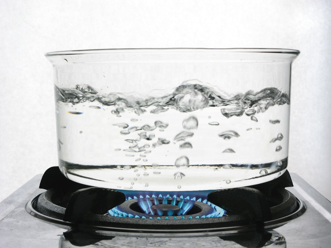  A photo of boiling water in a glass pot